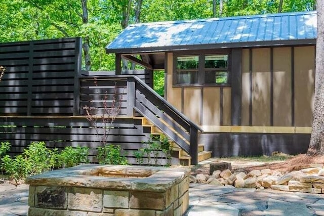 exterior space featuring an outdoor fire pit