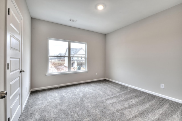 unfurnished room with carpet flooring