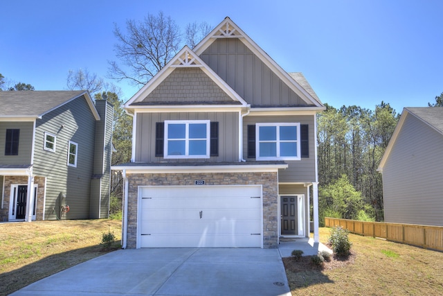 craftsman-style home featuring a front lawn and a garage