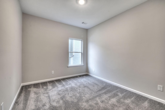 unfurnished room with carpet floors