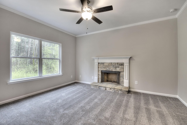 unfurnished living room with ornamental molding, carpet, ceiling fan, and a fireplace