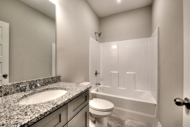 full bathroom featuring tile patterned floors, bathing tub / shower combination, vanity, and toilet