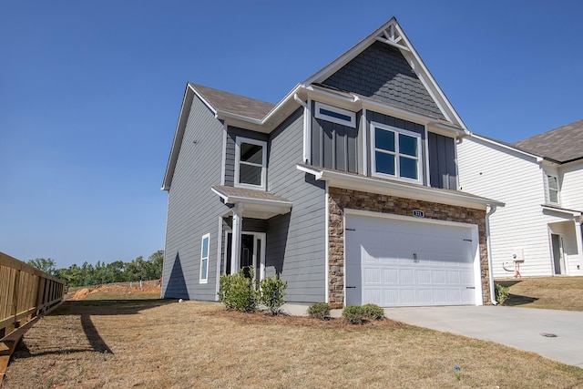 view of front facade featuring a garage and a front lawn