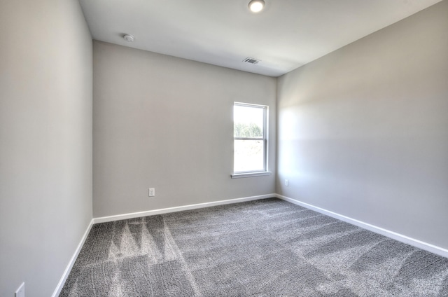 unfurnished room with carpet floors