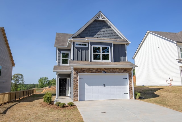 view of front facade featuring a garage and a front lawn