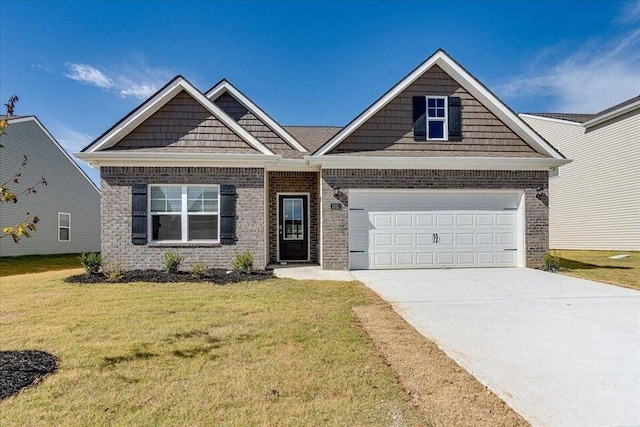 craftsman-style home featuring a front yard and a garage