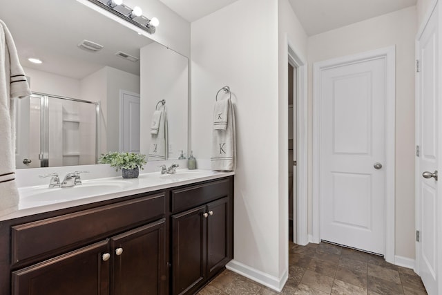 bathroom with vanity and an enclosed shower