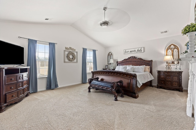 bedroom featuring light carpet, vaulted ceiling, and ceiling fan