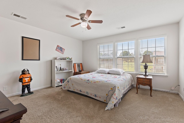 carpeted bedroom with ceiling fan