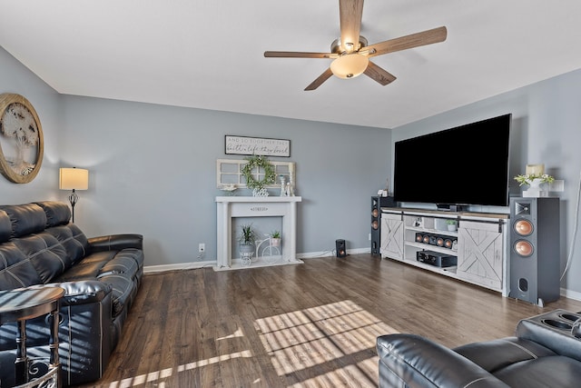 living room with hardwood / wood-style floors and ceiling fan