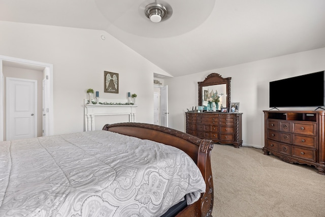 bedroom with vaulted ceiling, light carpet, and ceiling fan