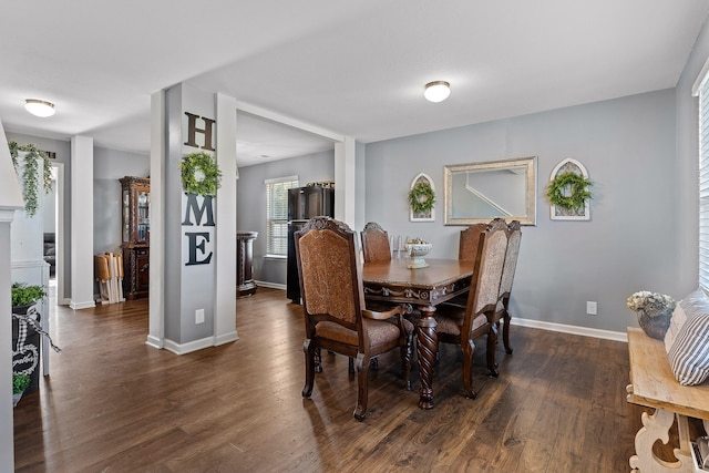 dining space featuring dark hardwood / wood-style flooring