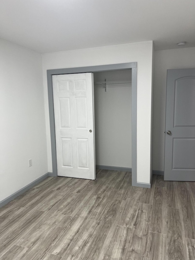 2008 Foust St, Chattanooga, TN 37407 - unfurnished bedroom featuring wood finished floors and a closet