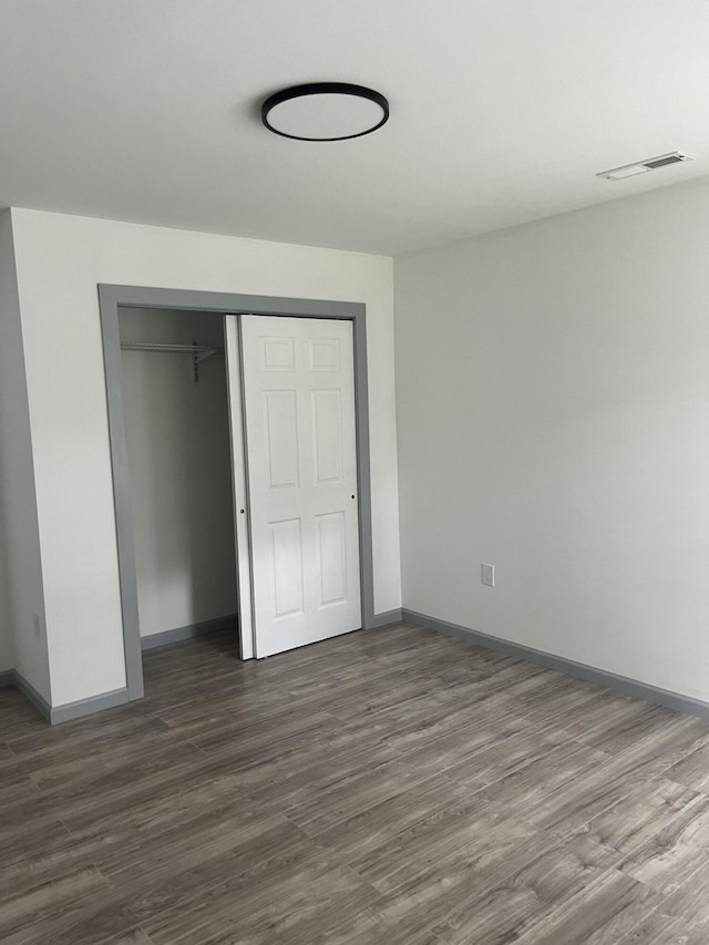2008 Foust St, Chattanooga, TN 37407 - unfurnished bedroom with dark wood-type flooring and a closet
