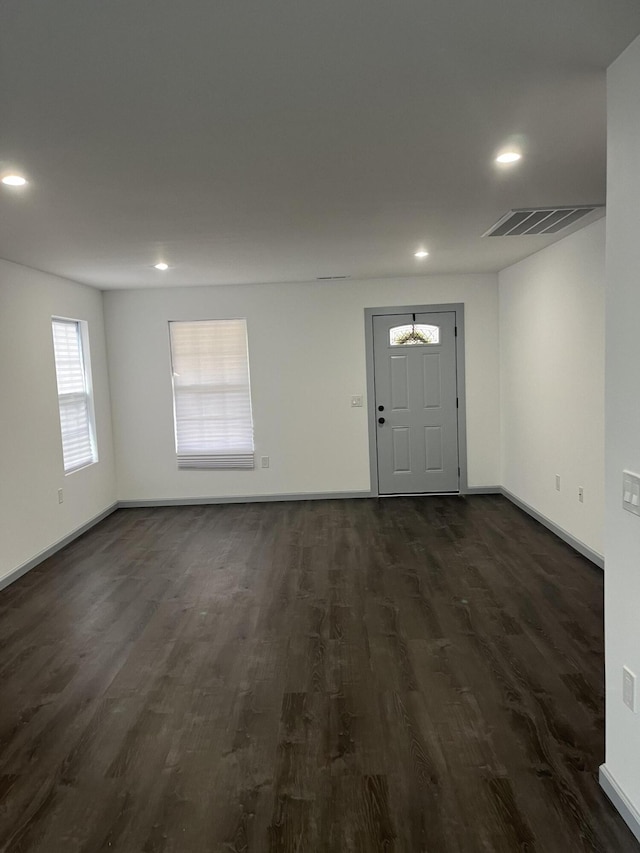 entryway with dark wood-type flooring