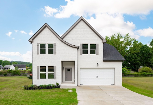 view of front facade featuring a garage and a front lawn