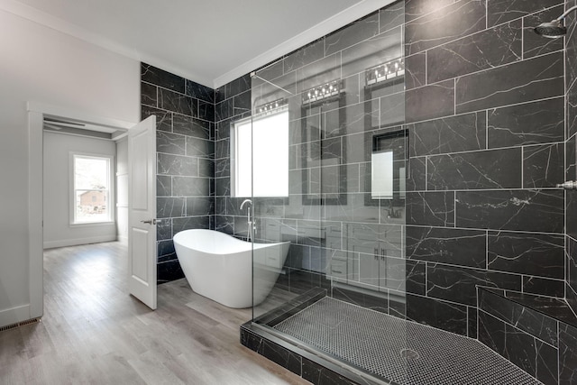 bathroom with separate shower and tub, tile walls, crown molding, and hardwood / wood-style floors