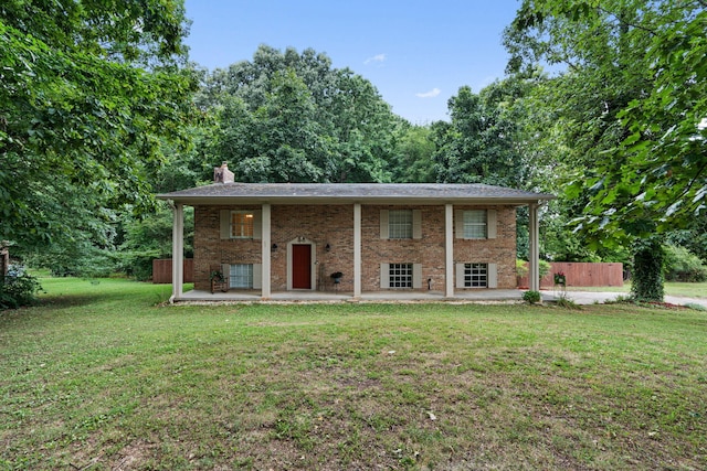 exterior space with a lawn and a patio