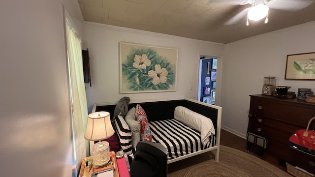 bedroom featuring ceiling fan and crown molding