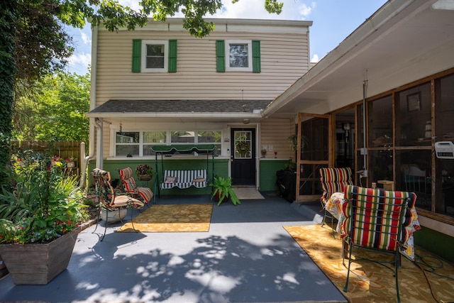 rear view of property featuring a patio