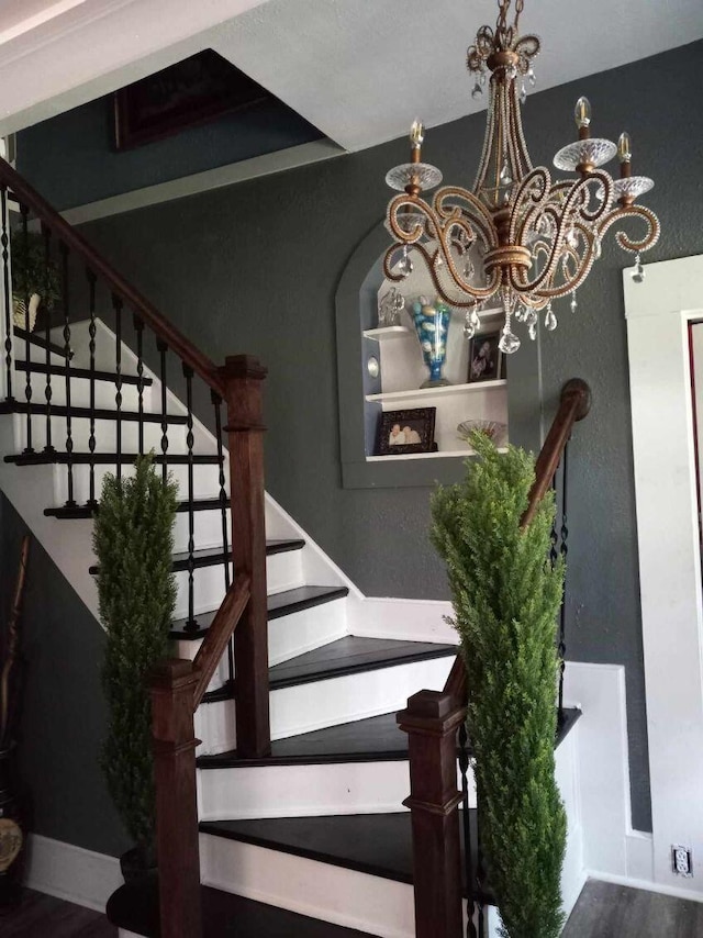 staircase with hardwood / wood-style flooring