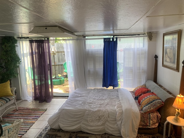 bedroom with light tile patterned flooring