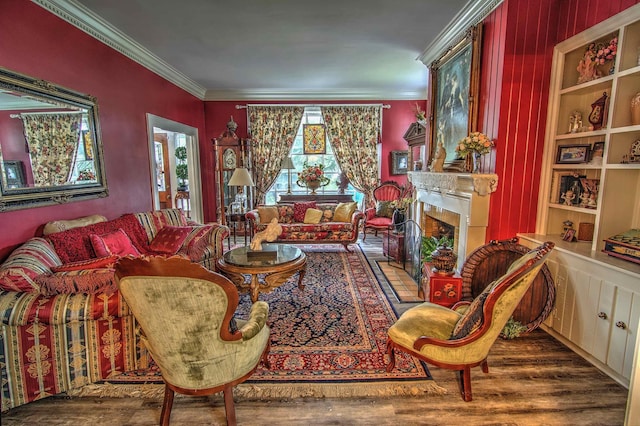 living room with dark wood-type flooring and ornamental molding