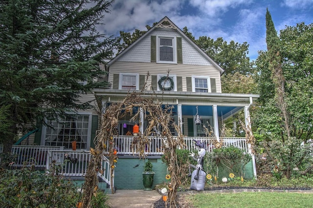 victorian house featuring covered porch