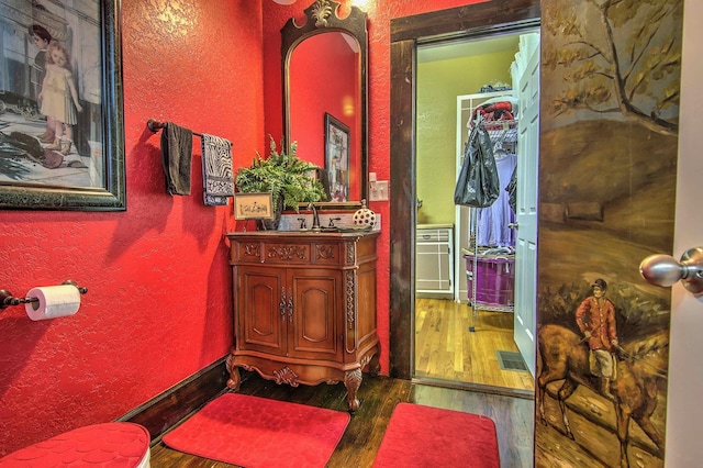 bathroom featuring vanity and hardwood / wood-style flooring