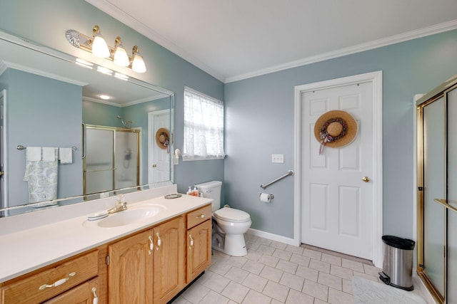 bathroom with vanity, tile patterned flooring, walk in shower, crown molding, and toilet