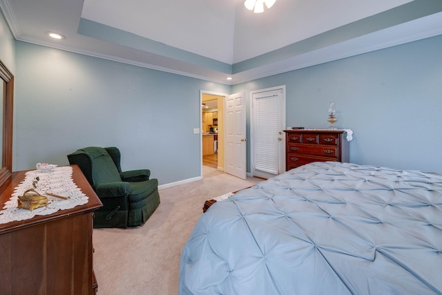 bedroom with light colored carpet, a closet, and ornamental molding