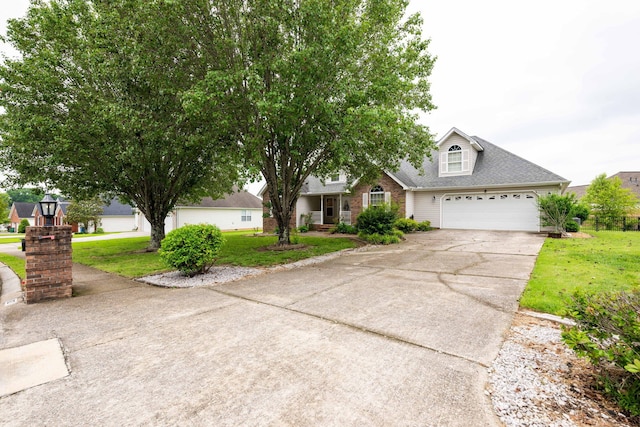 view of front of home with a garage and a front lawn