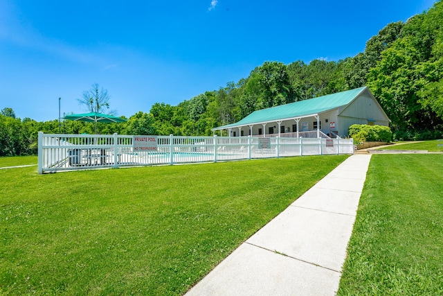 surrounding community with a yard, a patio, and a swimming pool