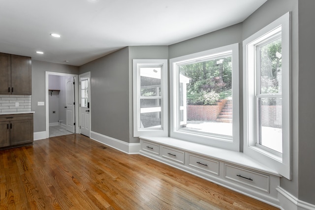 interior space with light hardwood / wood-style floors and a wealth of natural light