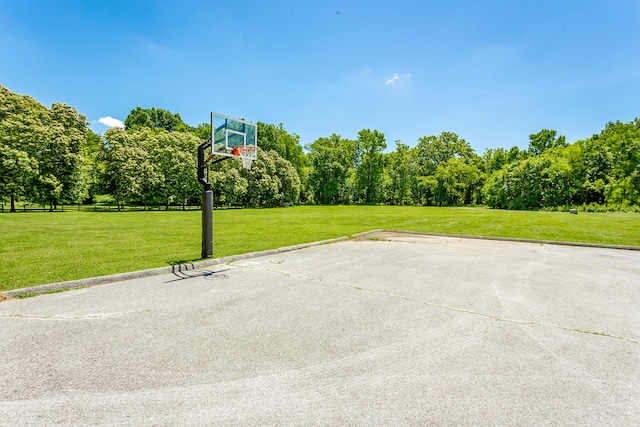 view of basketball court featuring a lawn