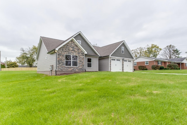 view of front of house with a front lawn and a garage