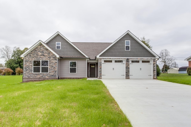 craftsman inspired home featuring a garage and a front lawn