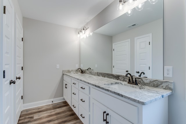 bathroom featuring vanity and wood-type flooring