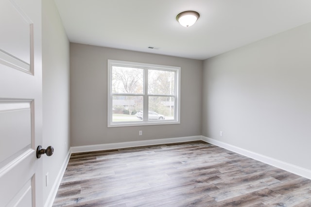 unfurnished room with light hardwood / wood-style floors