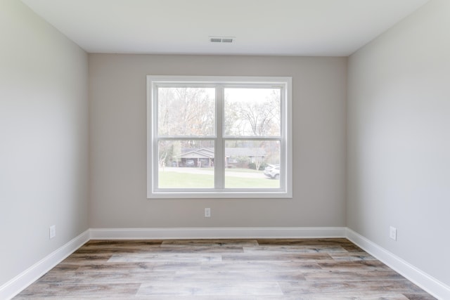 spare room featuring light hardwood / wood-style flooring