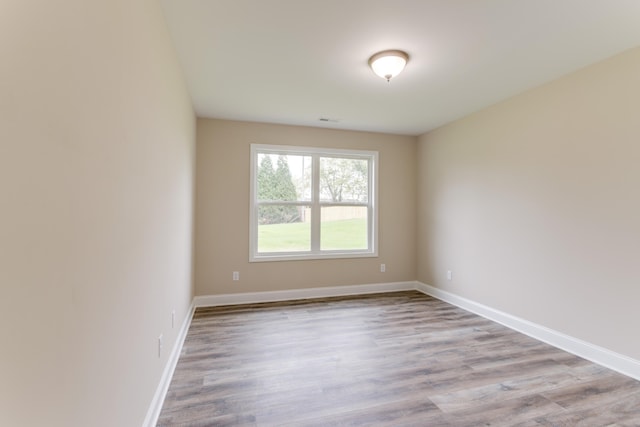 unfurnished room featuring light wood-type flooring