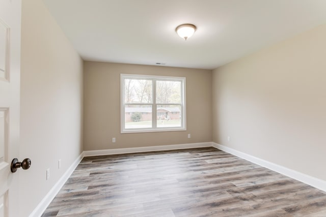 empty room with light hardwood / wood-style floors