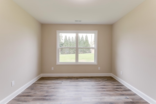 spare room with light wood-type flooring