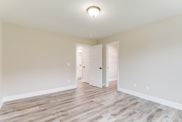 spare room with light hardwood / wood-style floors