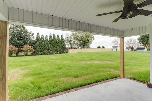 view of yard featuring ceiling fan and a patio area