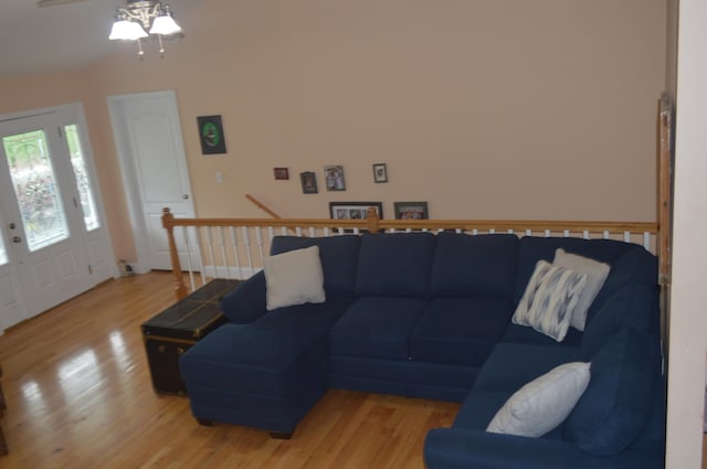 living room with ceiling fan and hardwood / wood-style flooring