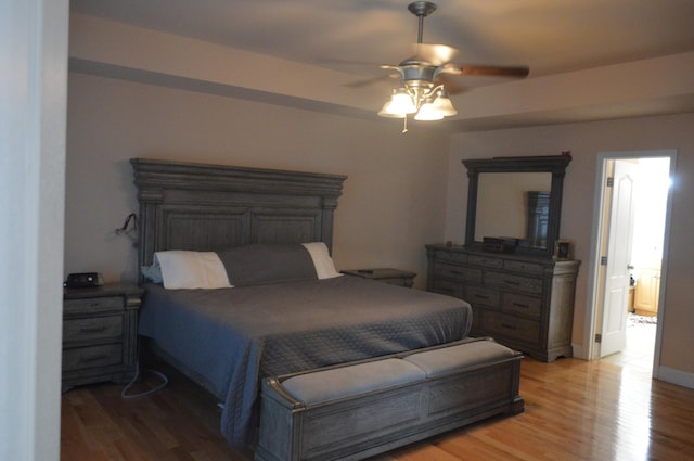 bedroom featuring hardwood / wood-style floors and ceiling fan