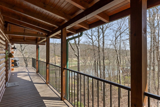 unfurnished sunroom with wood ceiling and lofted ceiling with beams