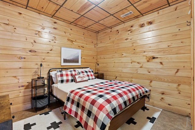 bedroom featuring carpet flooring, wood ceiling, and wood walls