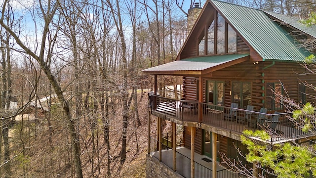 view of side of home featuring a deck